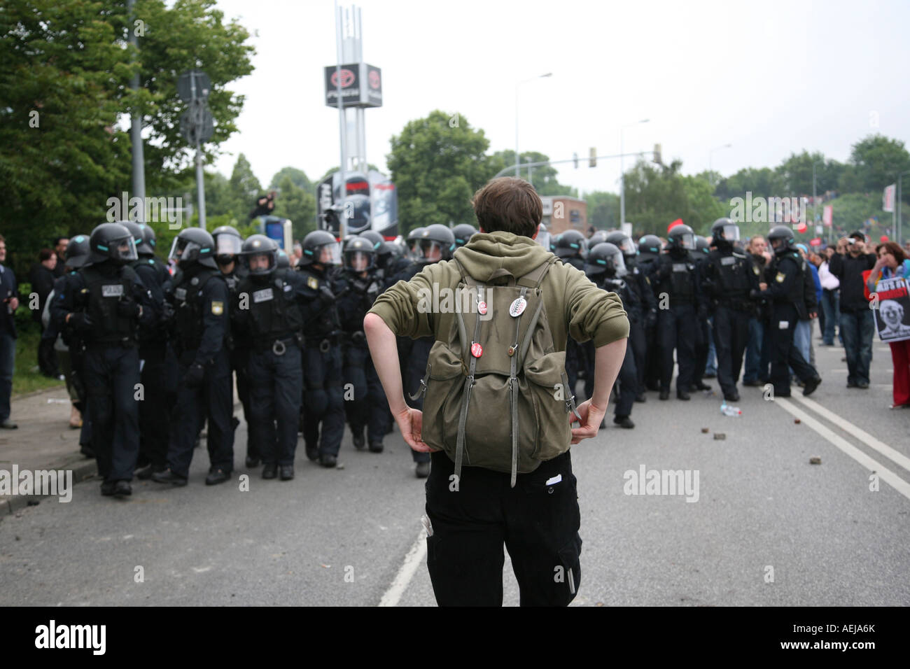 Demonstrant facing row or police officers, Heiligendamm, Rostock, Mecklenburg-Western Pomerania, Germany Stock Photo