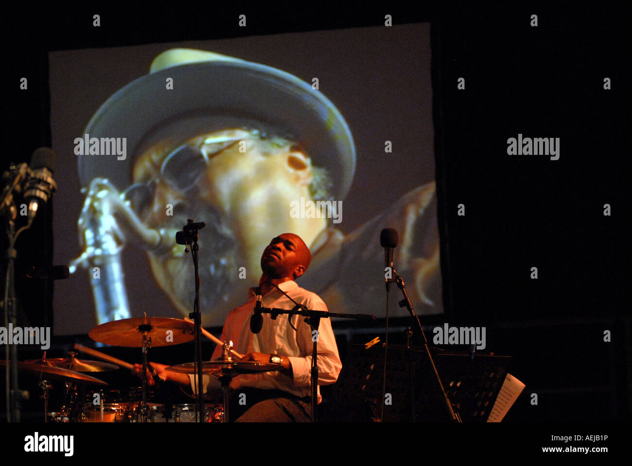 San Francisco Jazz Collective: Eric Harland. Joe Lovano in the background-projection Stock Photo