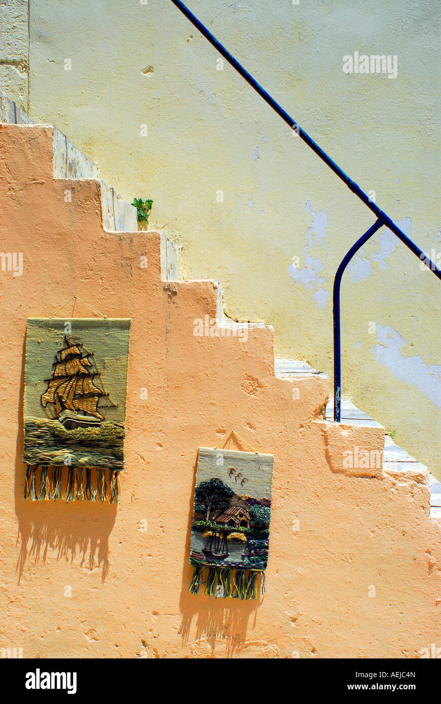 Stairs with tapestries, Fiscardo, Kefalonia, Ionian Islands, Greece Stock Photo