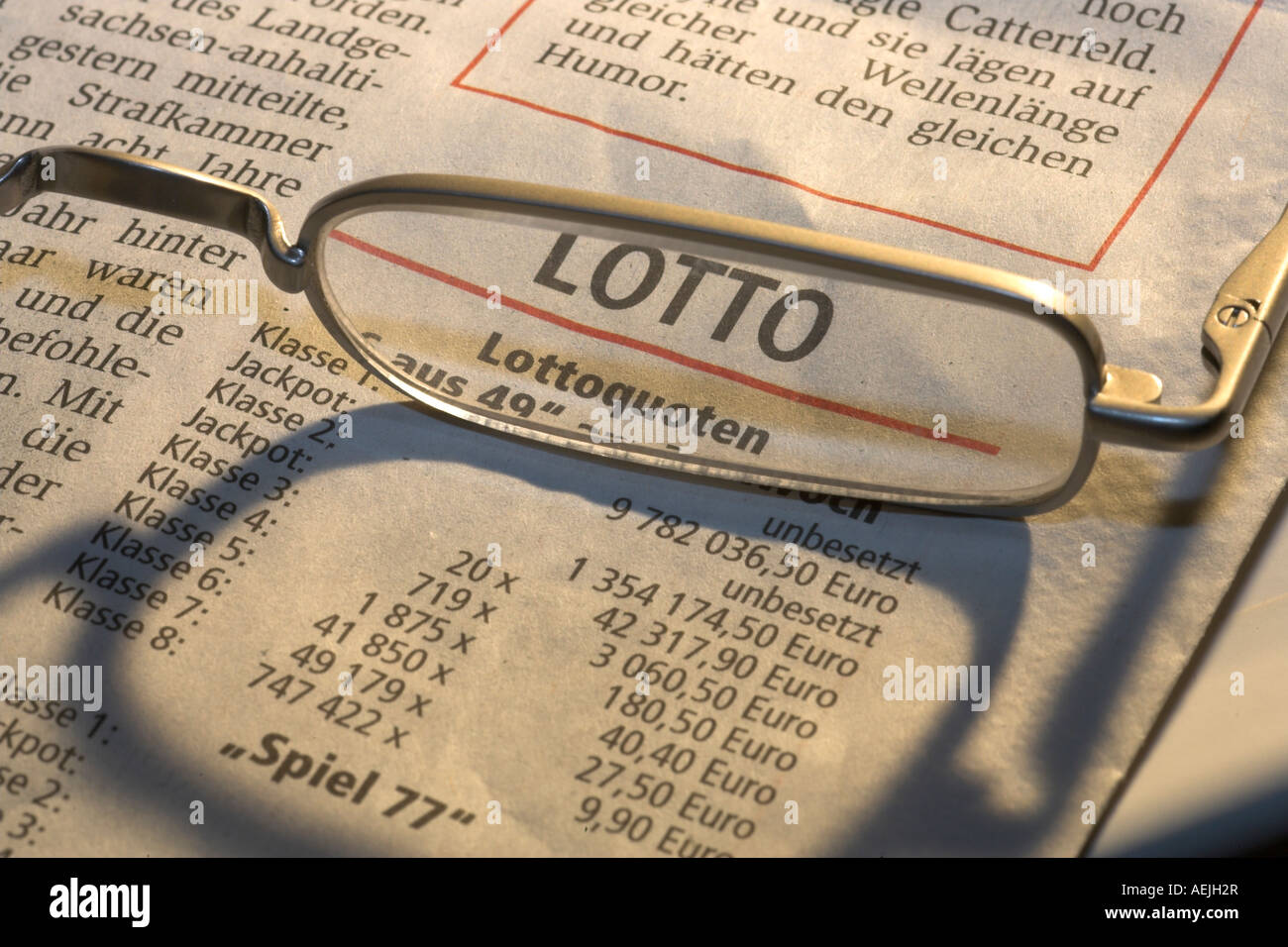 Reading glases lying on a newspaper Stock Photo