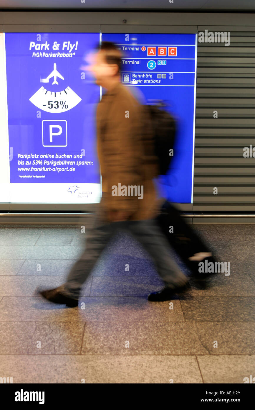 Passenger with suitcase at Frankfurt Airport, Frankfurt, Hesse, Germany Stock Photo