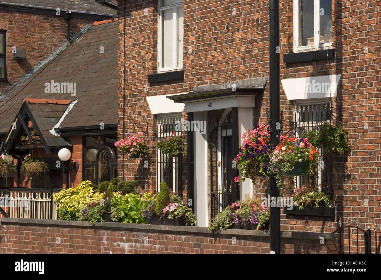 England Cheshire Stockport Cheadle Hulme Station Road flower filled