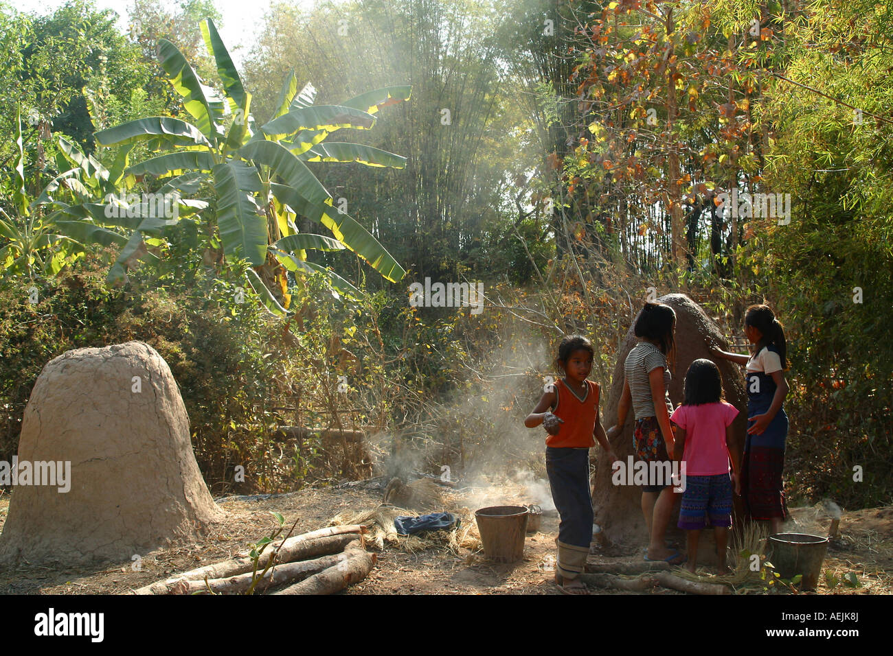 Children building a kiln made of loam, Siphandon, Laos Stock Photo
