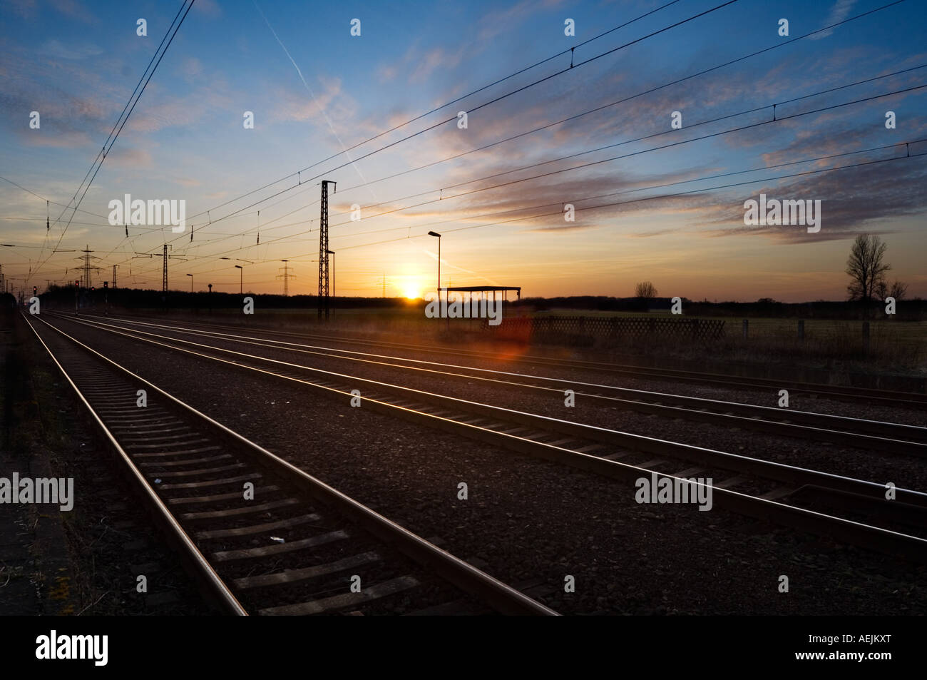 Electrified railroad line in the evening Stock Photo