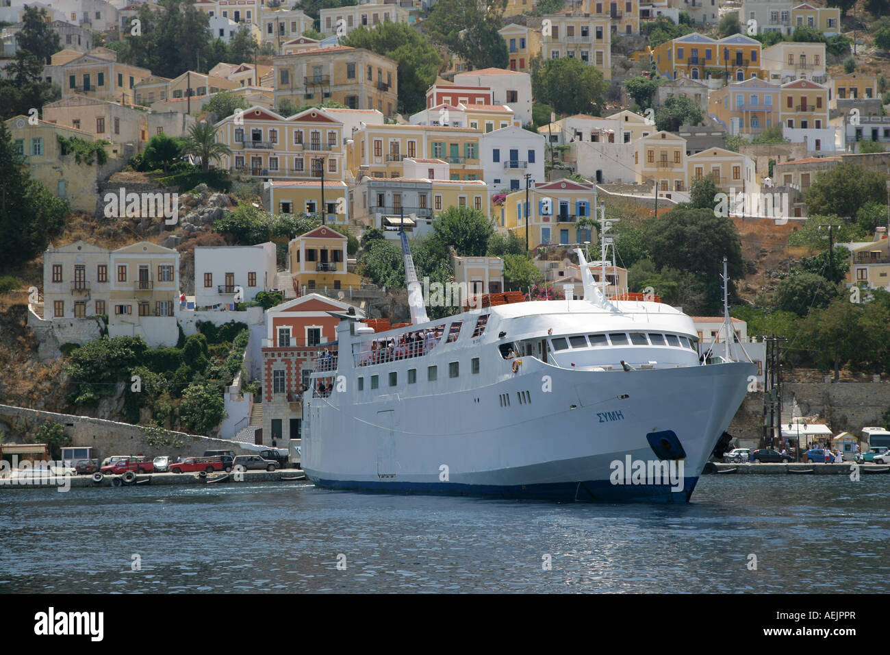 Ferry boat in the Port of the Isle of Symi near Rhodes, Greece, Europe Stock Photo