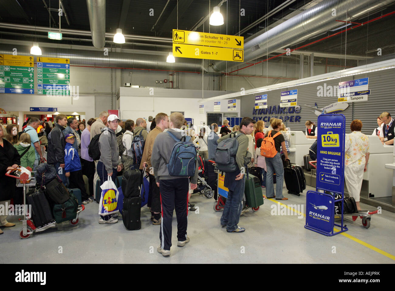 Passengers waiting at the check in on the airport Frankfurt-Hahn, Rhineland-Palatinate, Germany, Europe Stock Photo