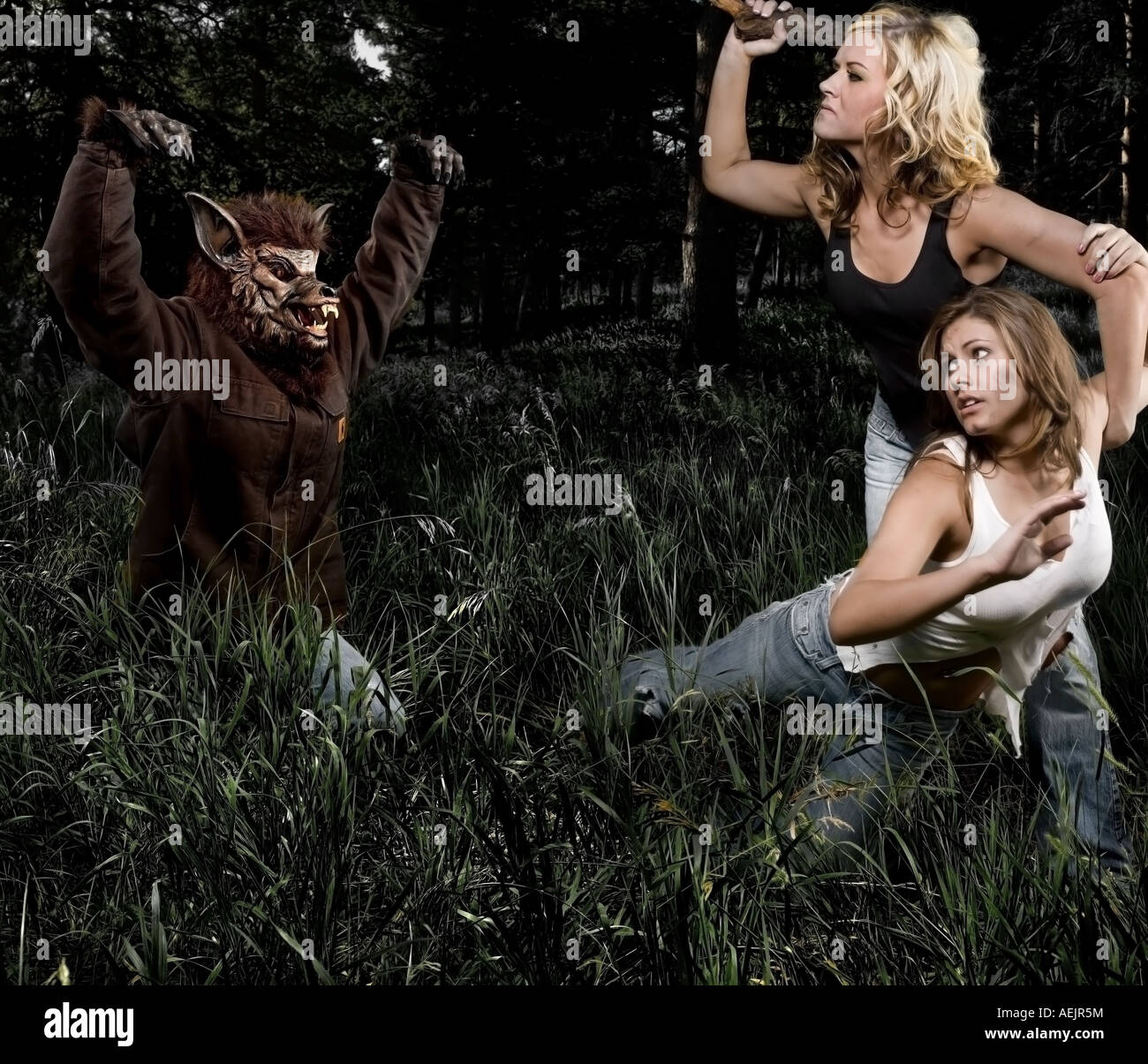 monster attacking two women Stock Photo Alamy