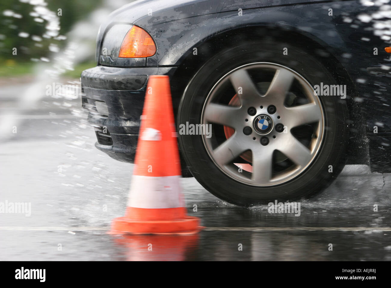 Braking maneuvers during an road safety training with wet conditions Stock Photo