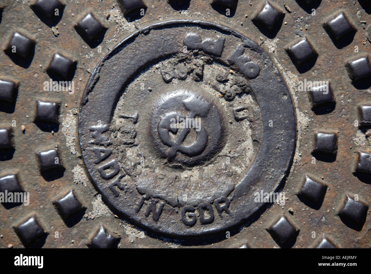 Old manhole cover from GDR times Stock Photo