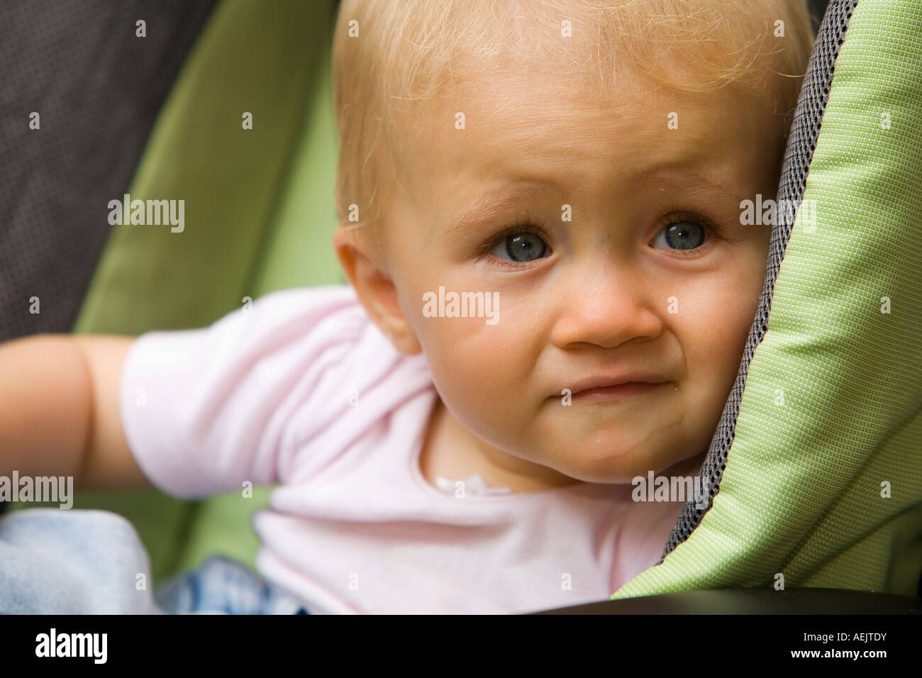 A 10 month old baby girl in a baby carriage Stock Photo