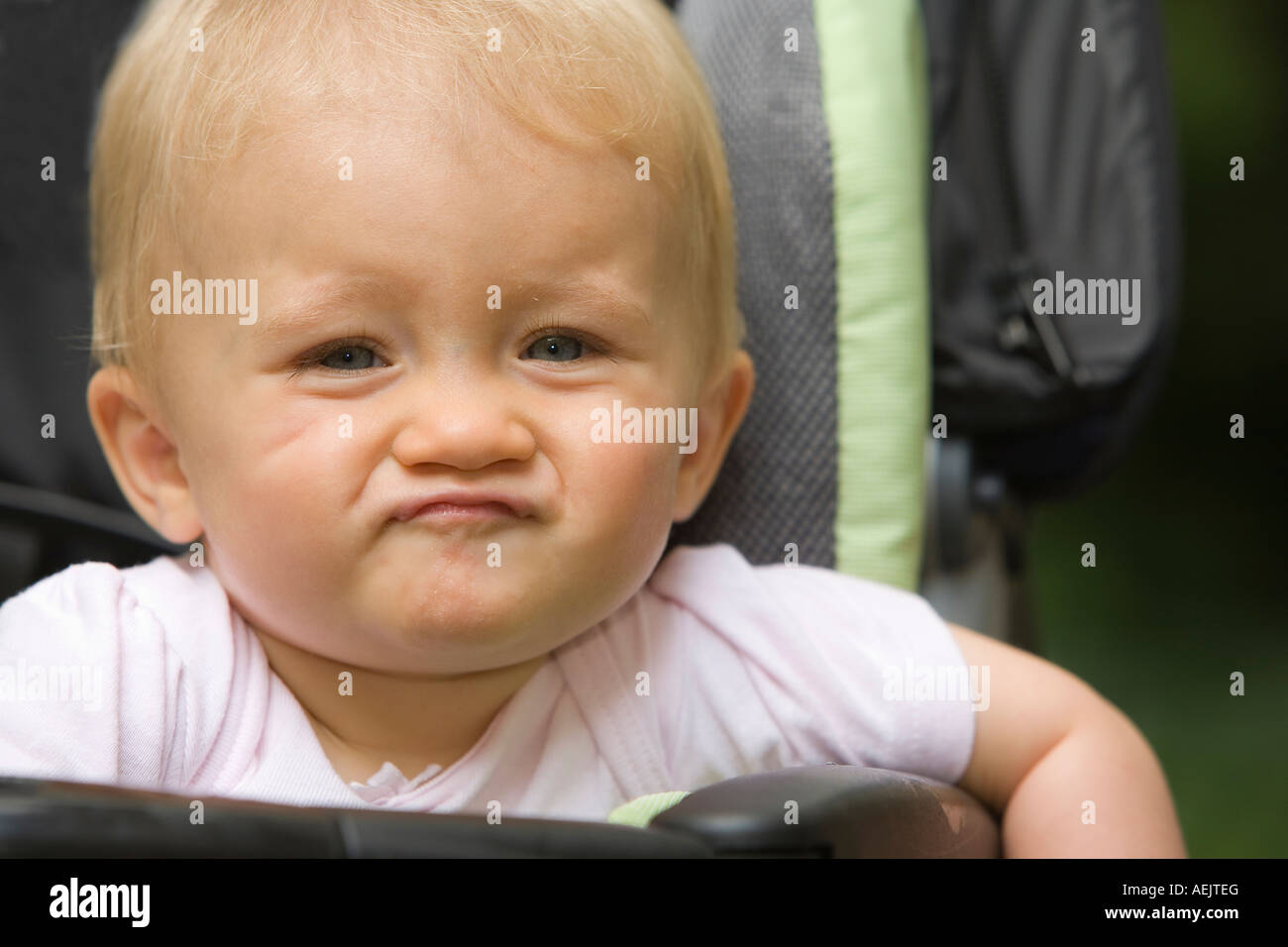 A 10 month old baby girl in a baby carriage Stock Photo