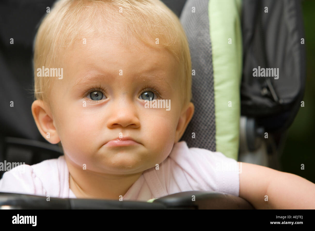 A 10 month old baby girl in a baby carriage Stock Photo
