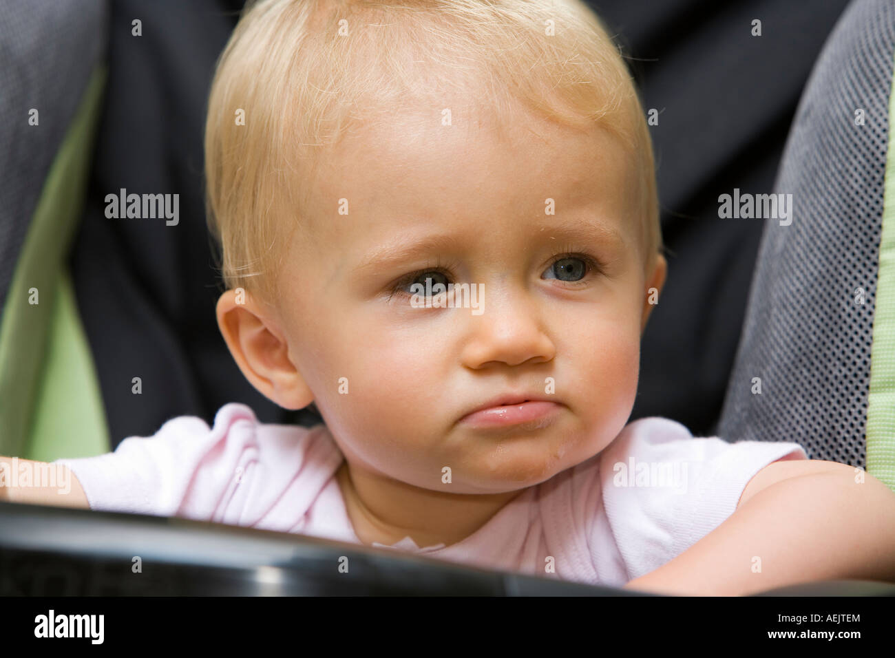 A 10 month old baby girl in a baby carriage Stock Photo