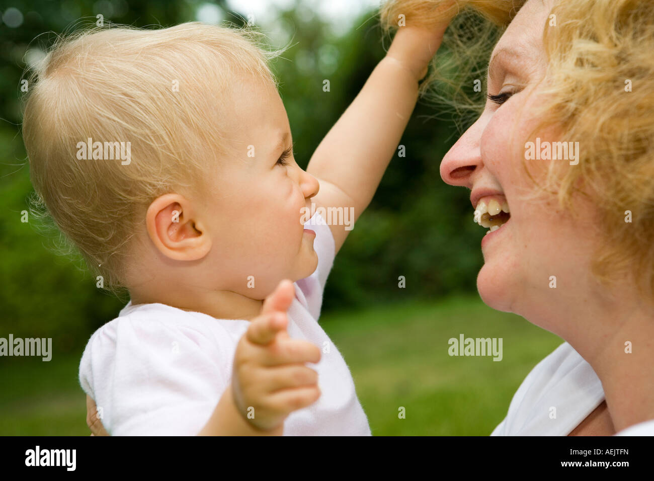 A young woman and her 10 month old baby girl Stock Photo