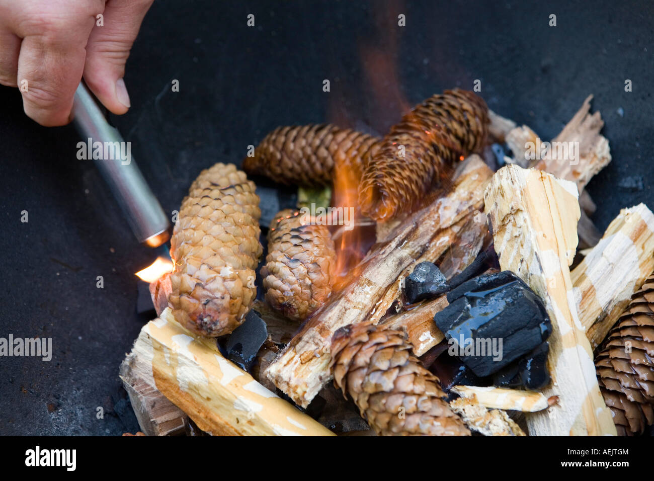 Lighting a fire for a barbecue Stock Photo