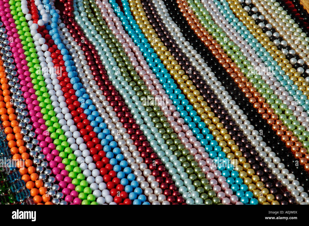 Sale stand with colourful pearl necklets, weekly market, Altea, Costa Blanca, Spain Stock Photo