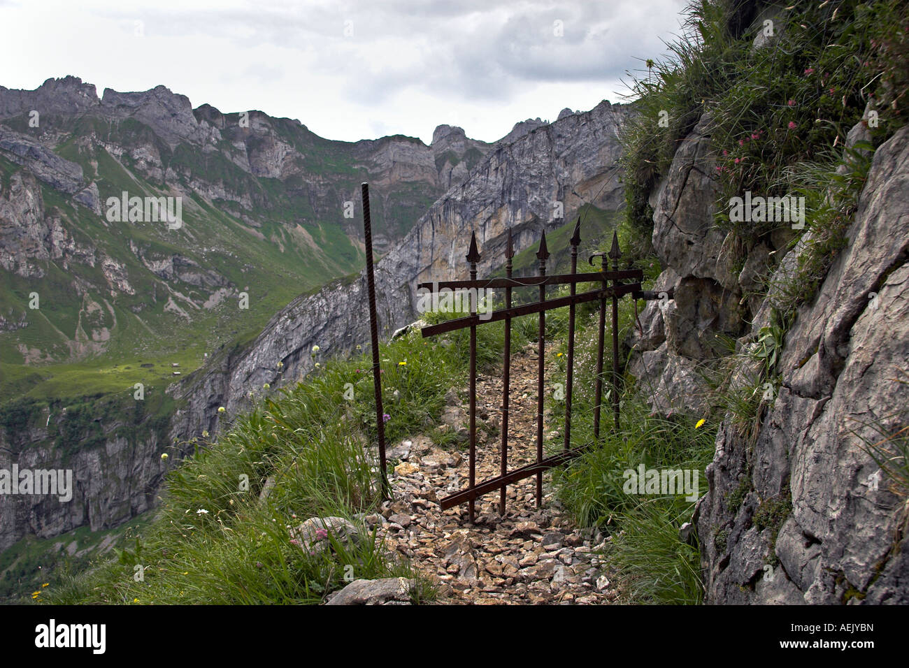 Mountain way with iron cattle gate in the Alpsteingebirge Canton Appenzell, Switzerland Stock Photo