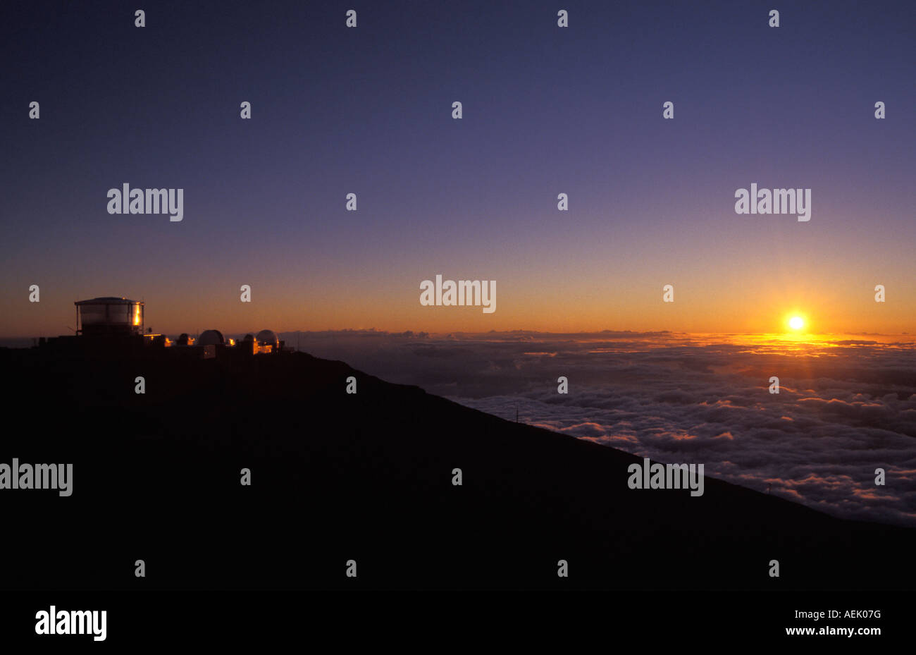 Sunset behind the observatory on Haleakala crater, Maui, Hawaii, USA Stock Photo