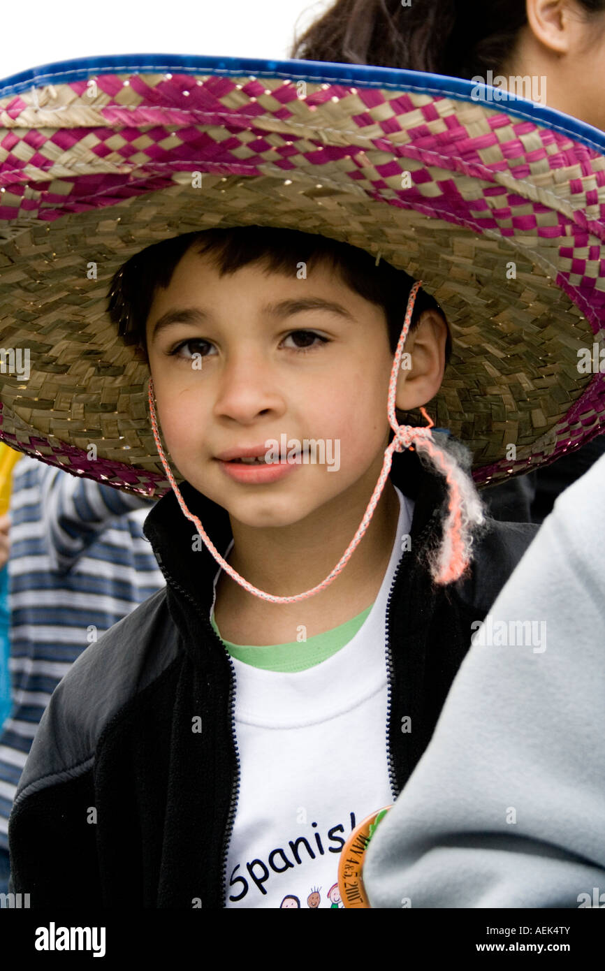 Young Chicano student marching in the Adams Spanish Immersion parade unit. Cinco de Mayo Fiesta. 'St Paul' Minnesota USA Stock Photo