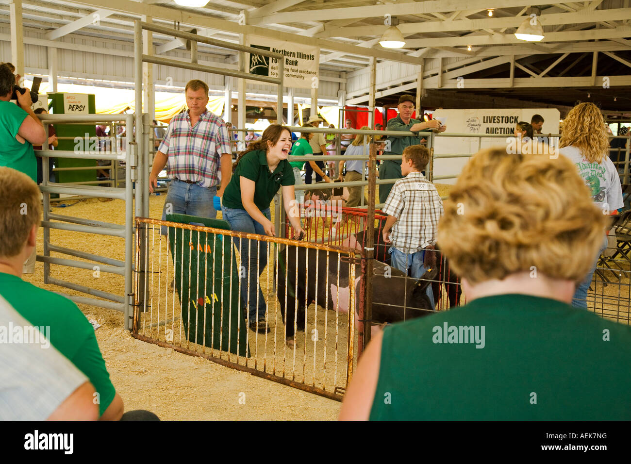 ILLINOIS Grayslake Livestock auction at Lake County Fair sold to highest bidder girl laugh as