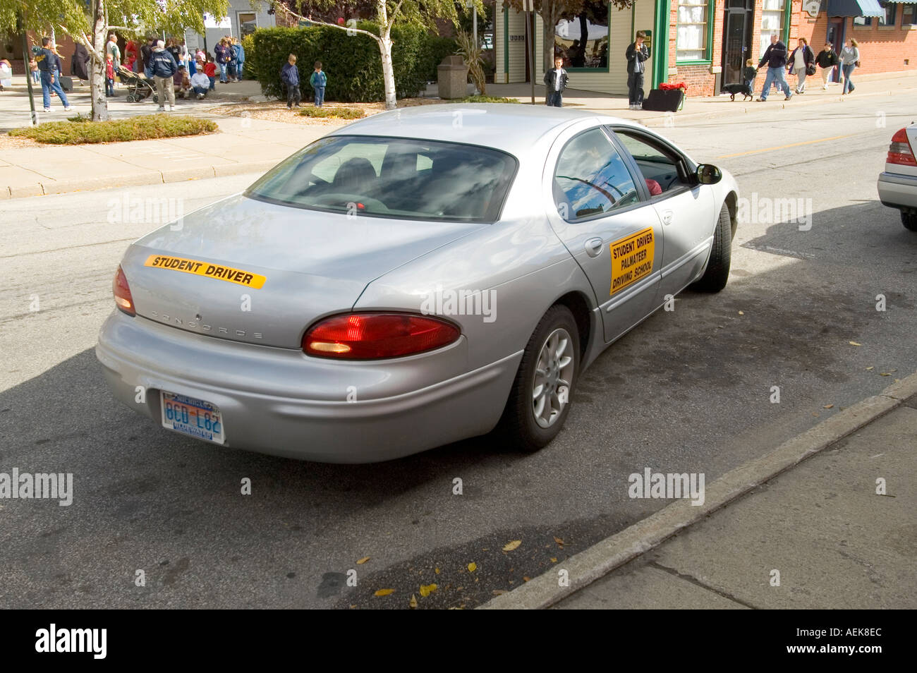 Teen student driver learns to parallel park a car Stock Photo