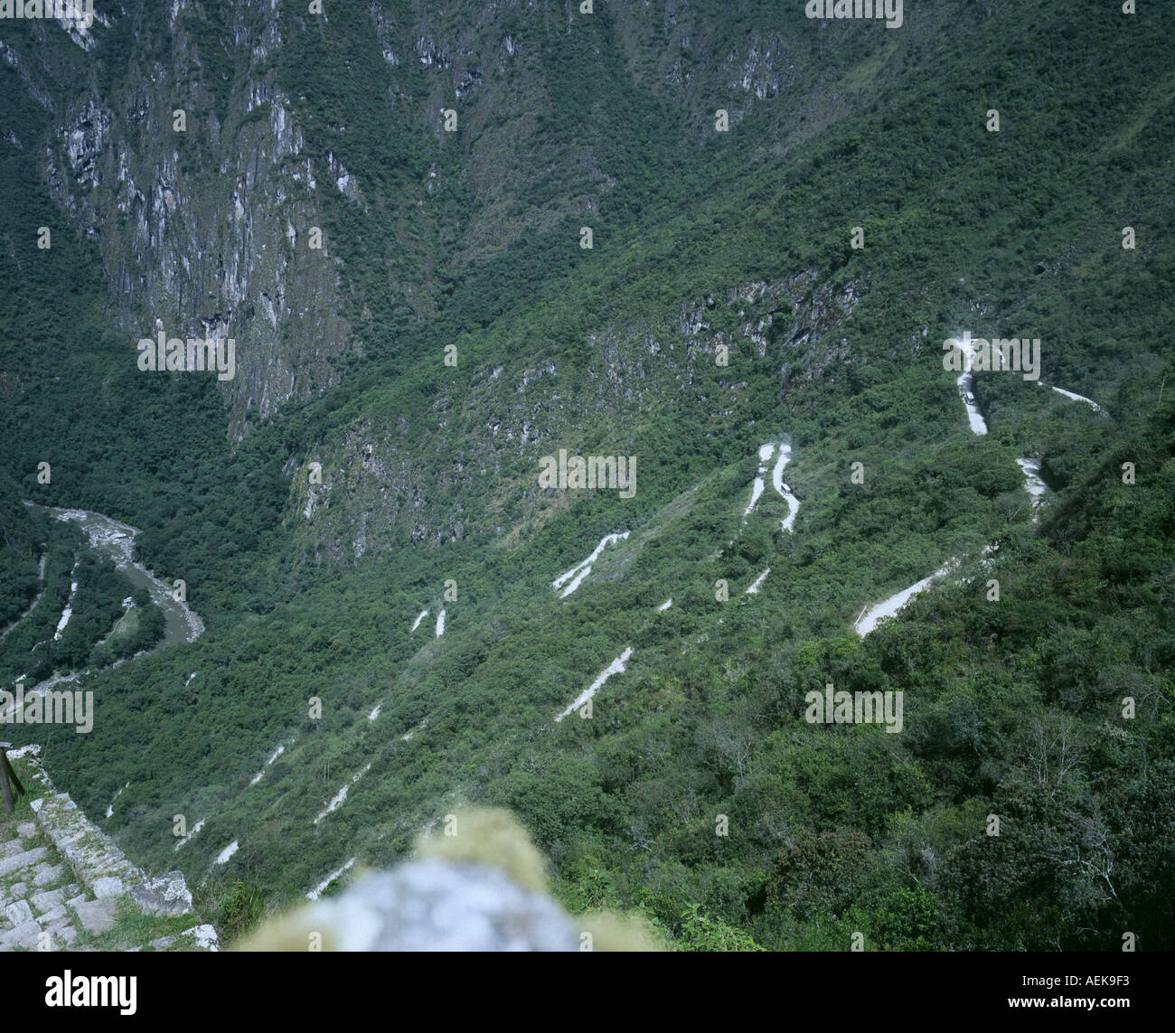 Winding road to take passengers from train station Aguas Calientes up to Machu Picchu lost city Peru  2004 Stock Photo