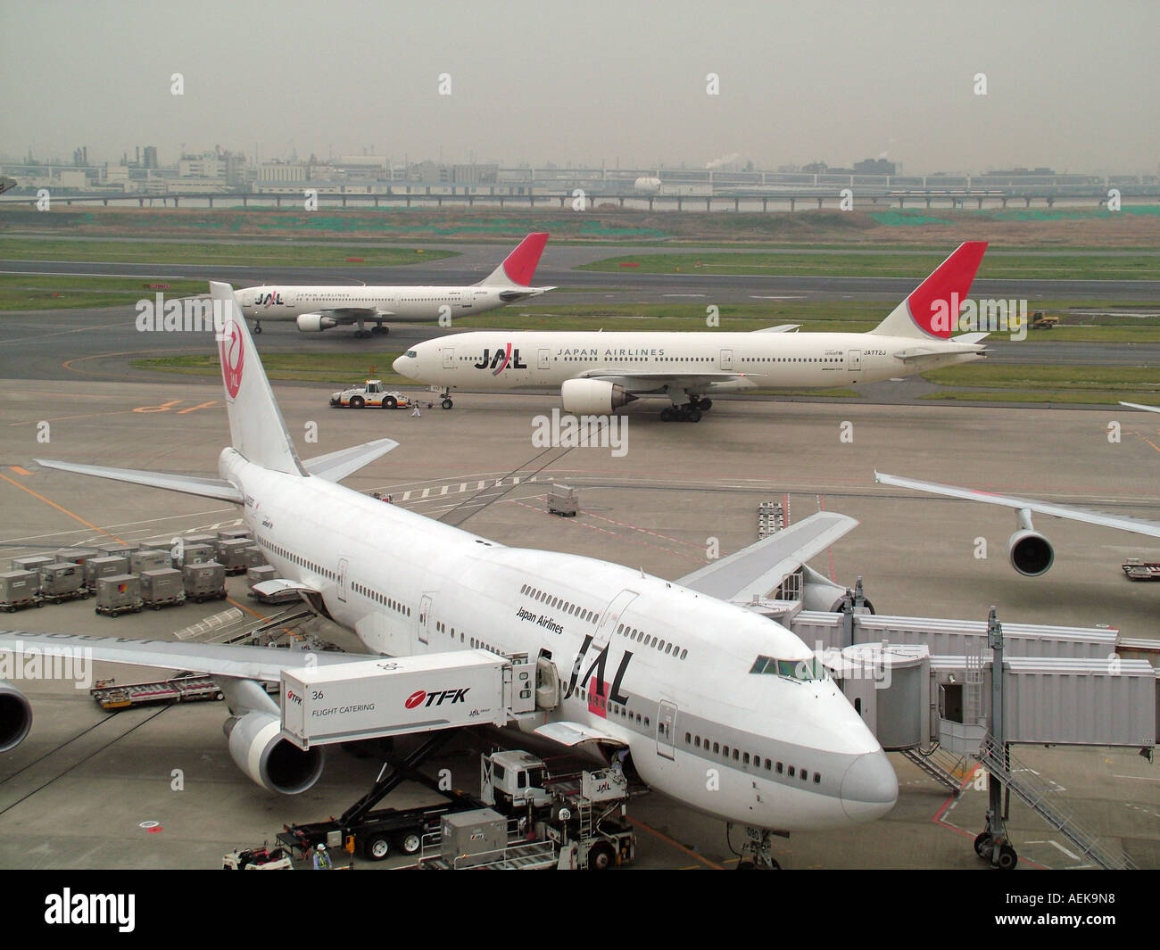 JAL aircraft at Norita Airport Tokyo Japan Asia. 747 jet in foreground Stock Photo
