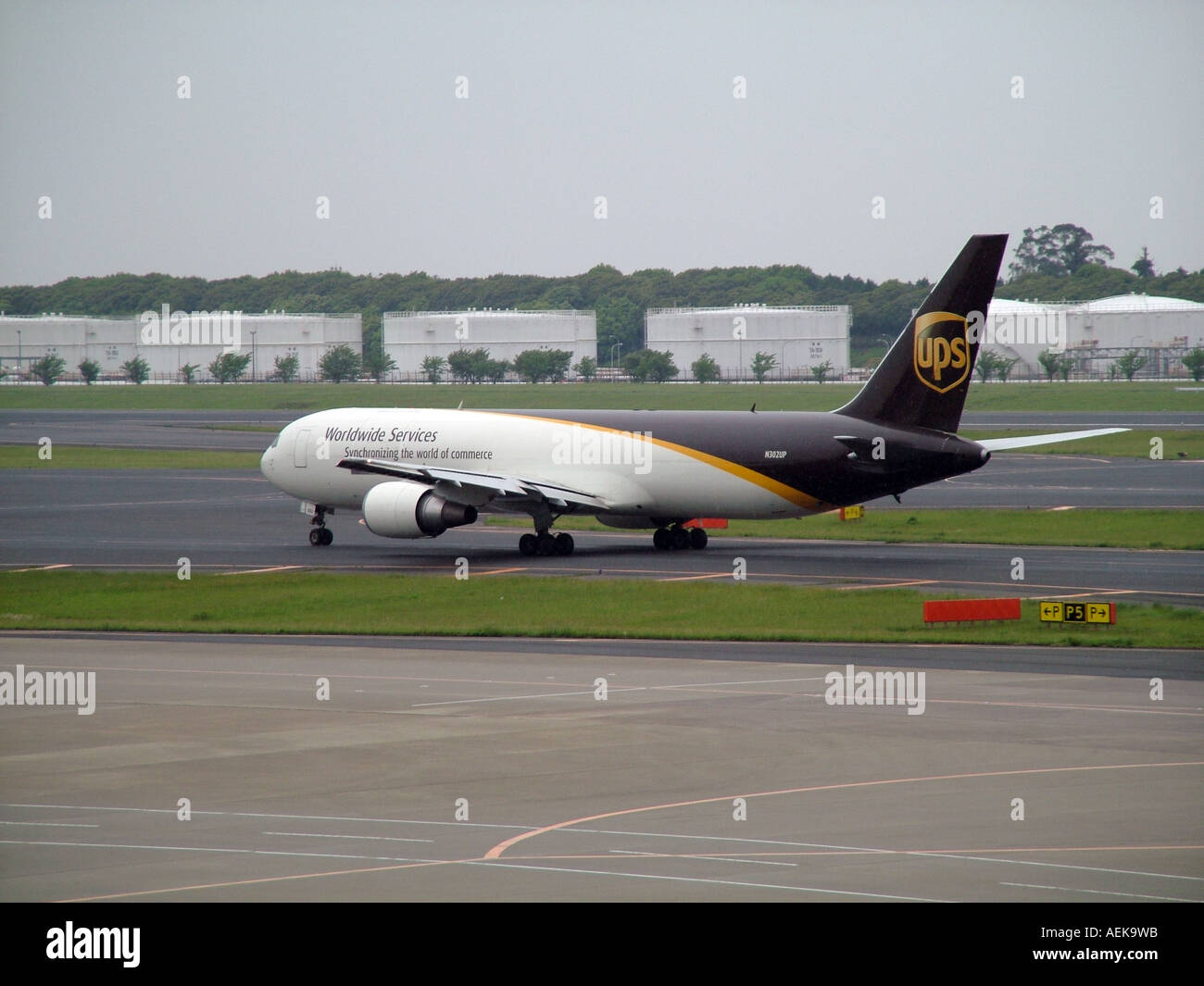 UPS cargo plane on runway Tokyo Airport Japan N302UP Stock Photo