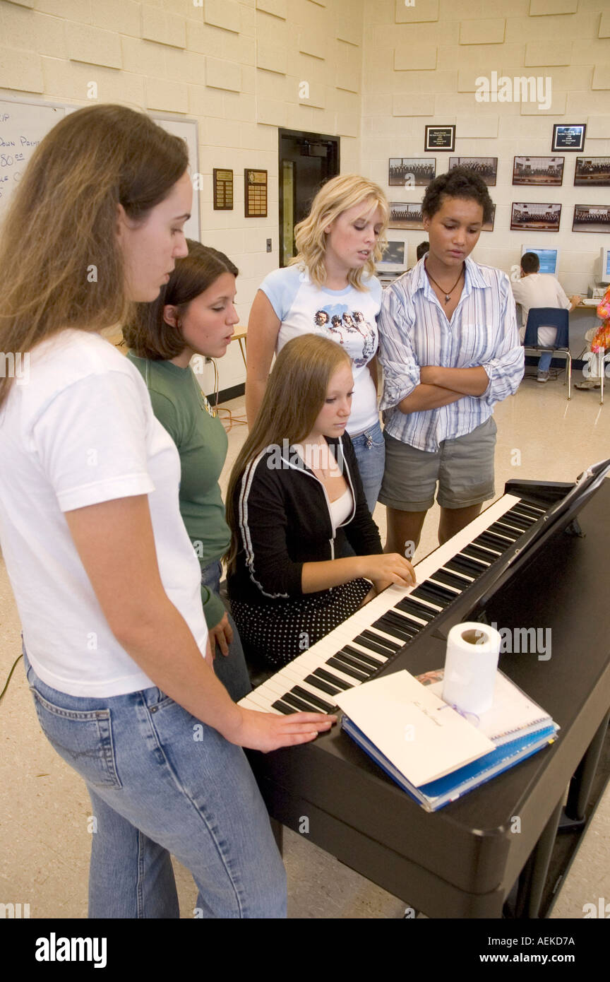 High school students practice musical routine using piano in choir class  Stock Photo - Alamy