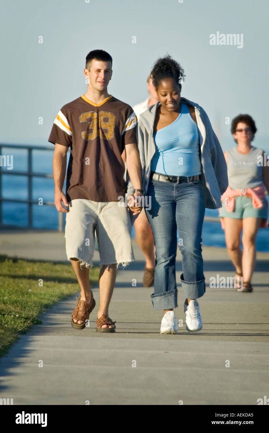Mixed racial couple walking for pleasure and exercise Stock Photo