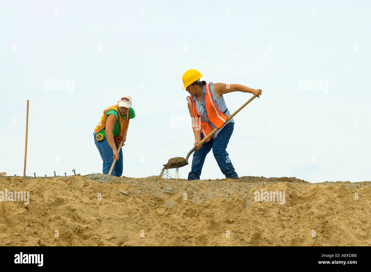 Female Road Construction workers build a bridge over highway Interstate I 94 Stock Photo