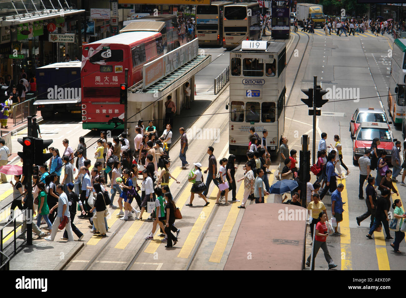 Pedestrians crossing zebra cross in Central district Hong Kong China