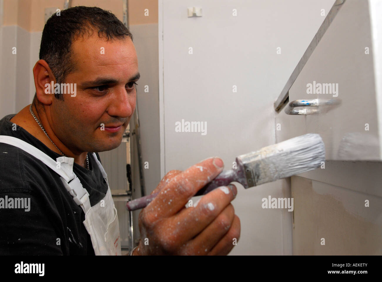 Painter And Decorator Painting Kitchen For Housing Association As Stock Photo Alamy