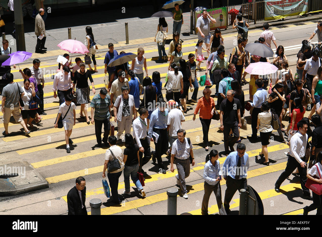 Pedestrians crossing zebra cross in Central district Hong Kong China
