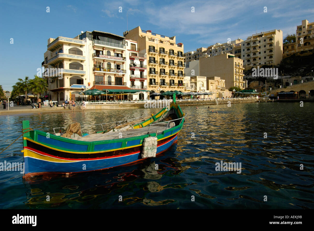 Traditional Luzzu boat moored in Xlendi seaside village situated in the