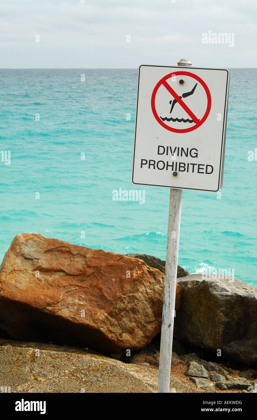 Diving Prohibited sign on rocks at City Beach, Perth, Western Australia ...