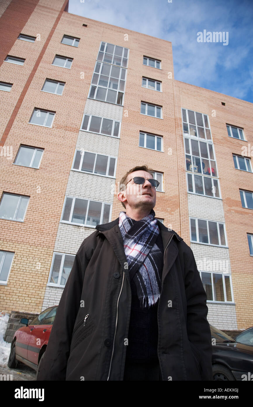 Man purchase the new appartment look up by new building Stock Photo