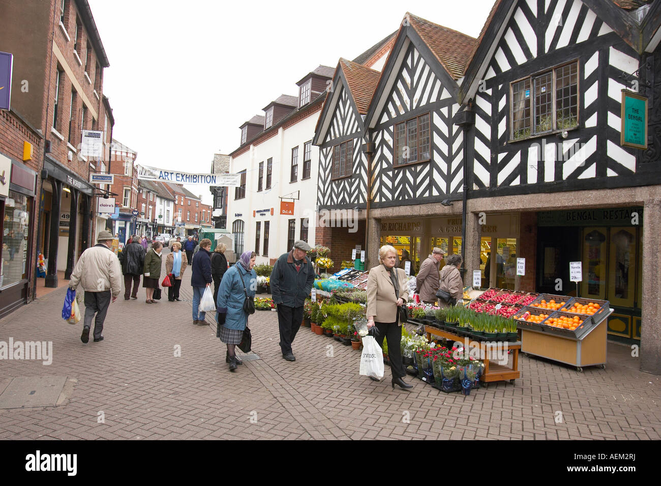 Shoppers walk around Lichfield town centre Stock Photo Alamy