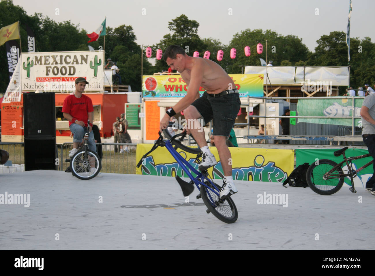 BMX rider balancing his bike at the Sprite Urban Games Clapham Common ...