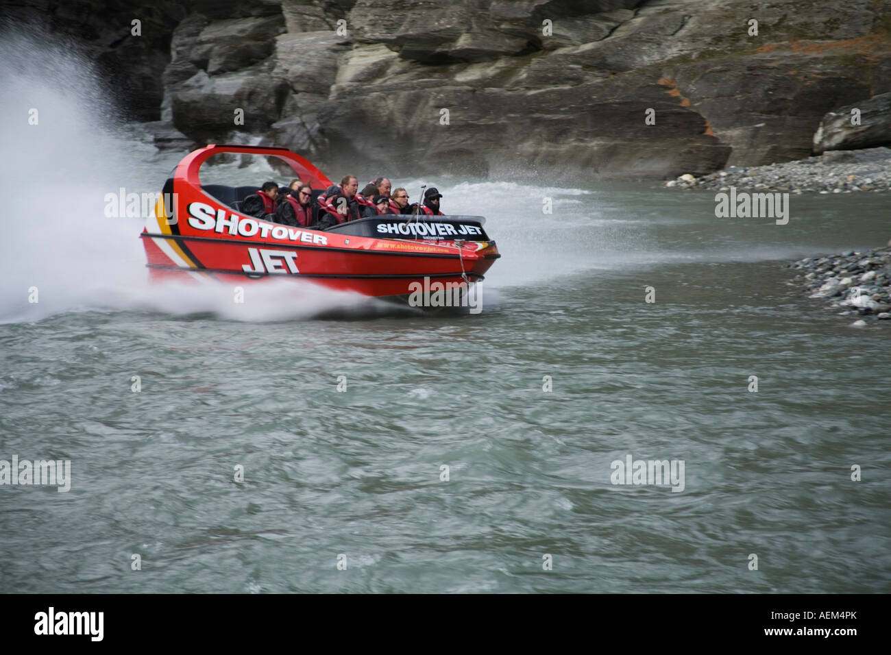 ARTHUR'S POINT SOUTHERN LAKES SOUTH ISLAND NEW ZEALAND May The Shotover Jet Boat screams past Stock Photo