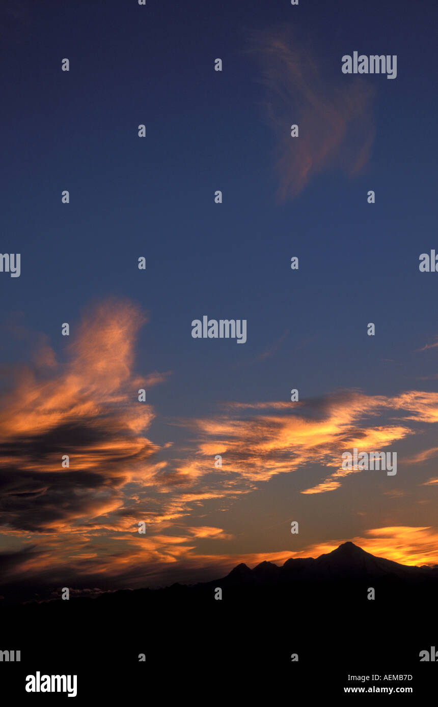 Stormclouds at sunset over Iliamna volcano Alaska Stock Photo