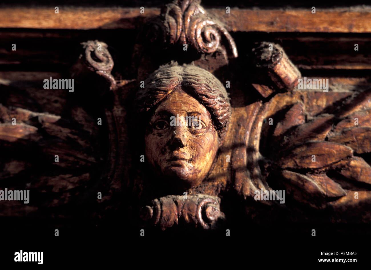 Ornate wooden carving of a face above a doorway on Sucre s colonial plaza Bolivia South America Stock Photo