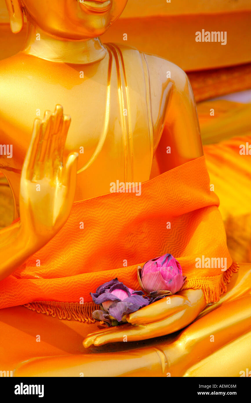 Flower offerings and Buddha, Wat Tham Seua (Tiger Cave Temple), Krabi, Thailand Stock Photo