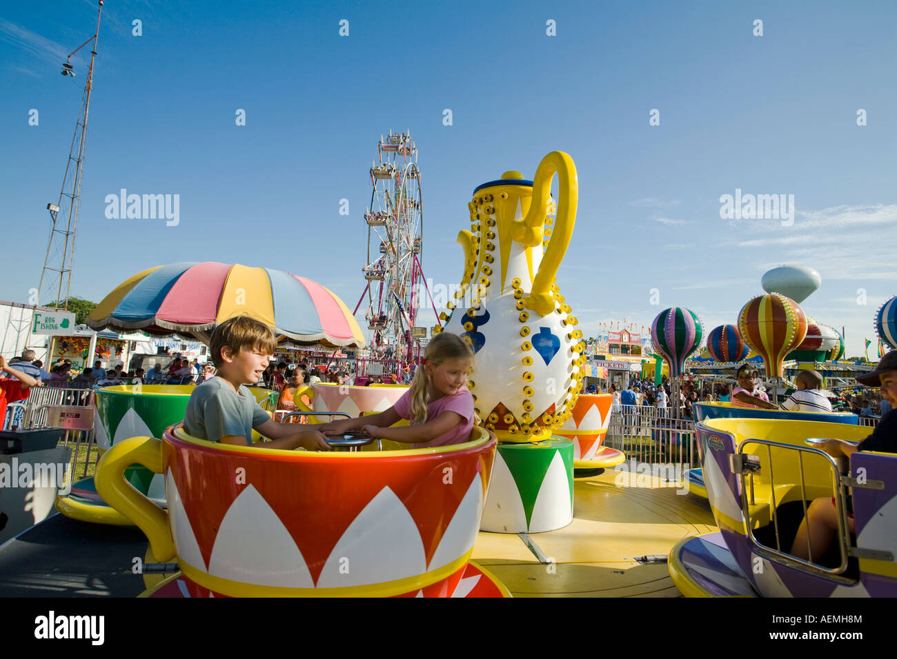 ILLINOIS Grayslake Younger children ride in coffee cup ride at Lake ...