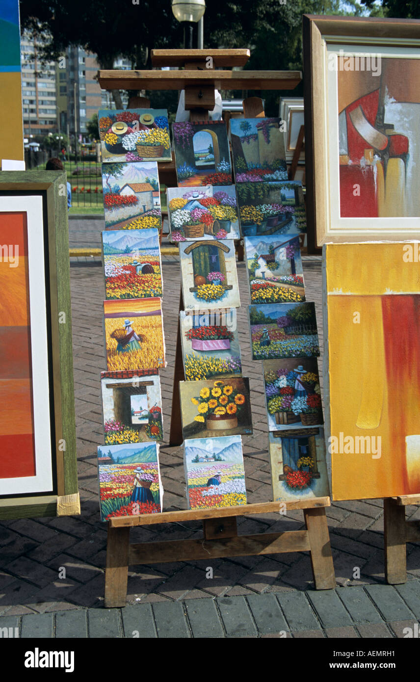 Colourful paintings for sale on an easel, Miraflores, Lima, Peru Stock Photo