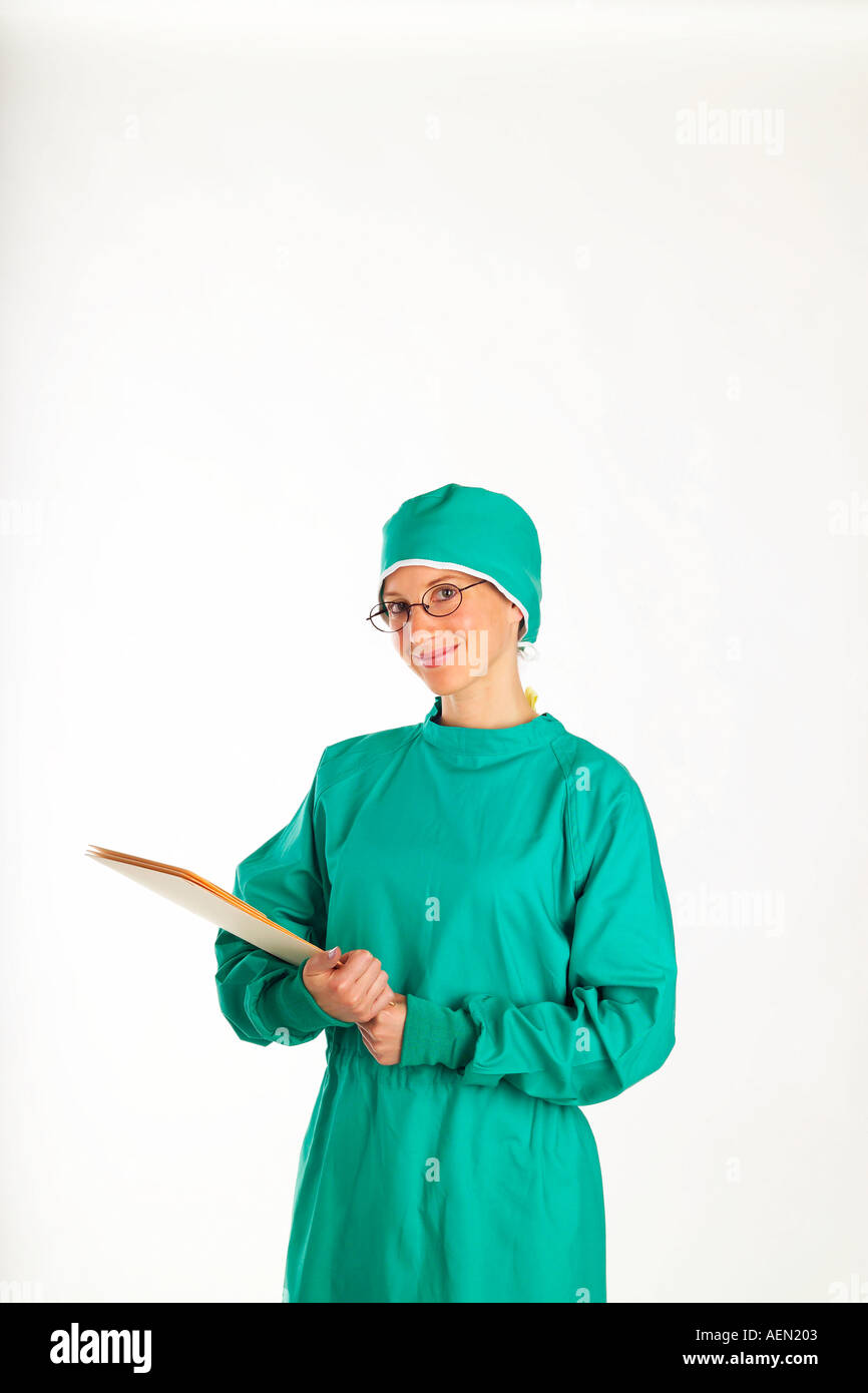 Nurse doctor surgery scrubs female woman surgical gown medical records hospital clinic glasses green health healthcare medical i Stock Photo