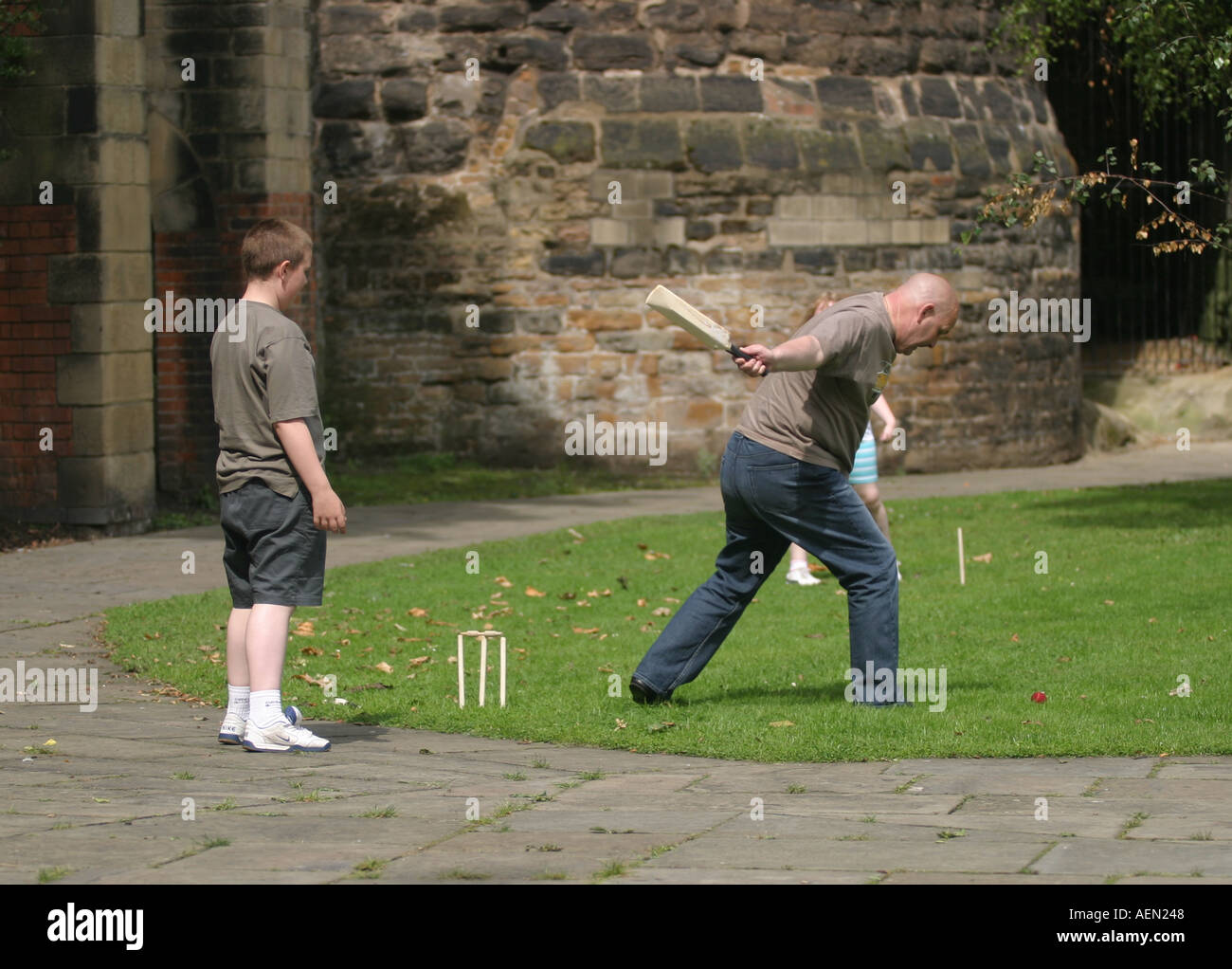 Family playing cricket in front of Nottingham Castle Stock Photo - Alamy