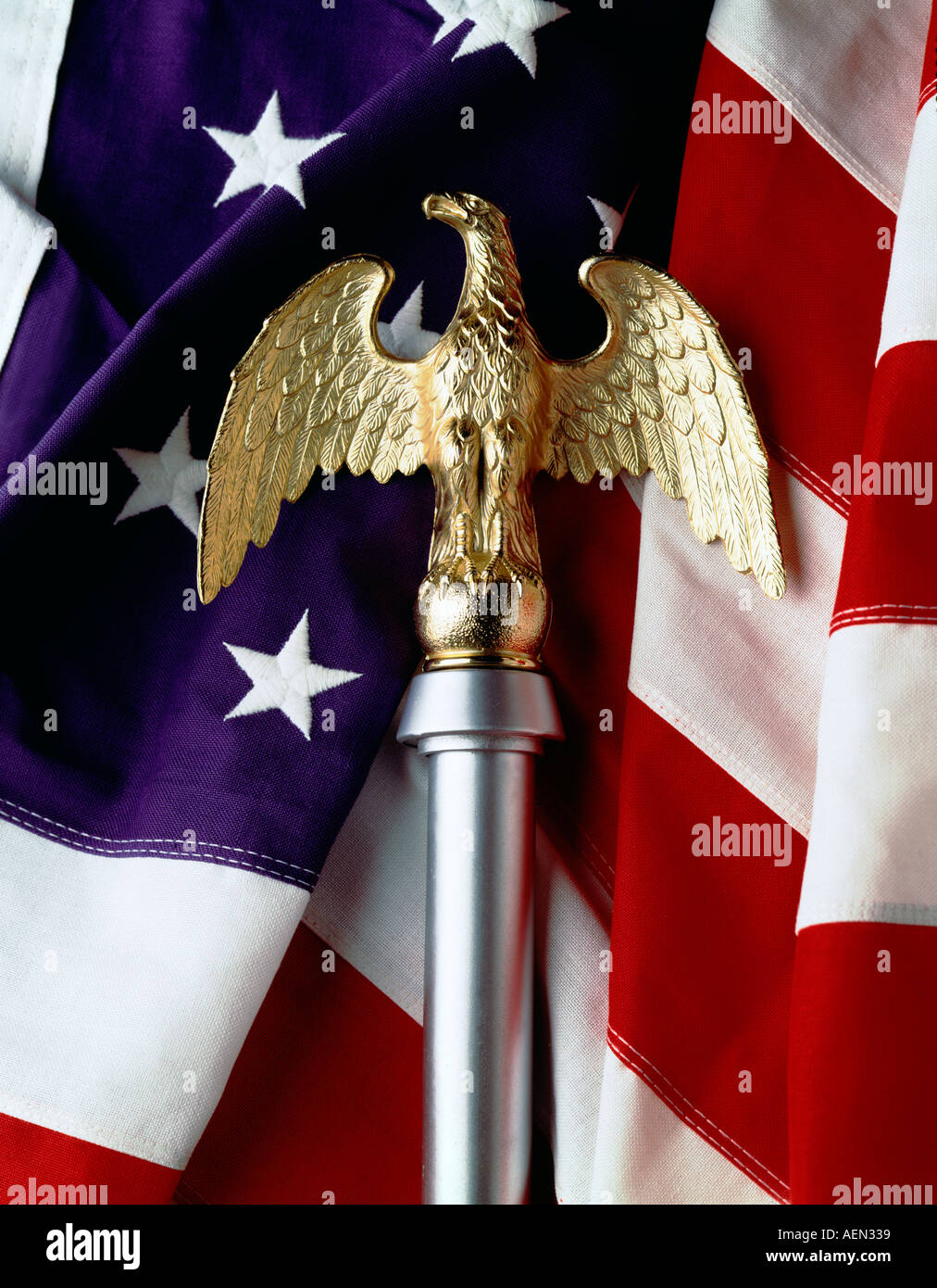 still life of golden american eagle flag ornament with american flag, stars and stripes. Stock Photo