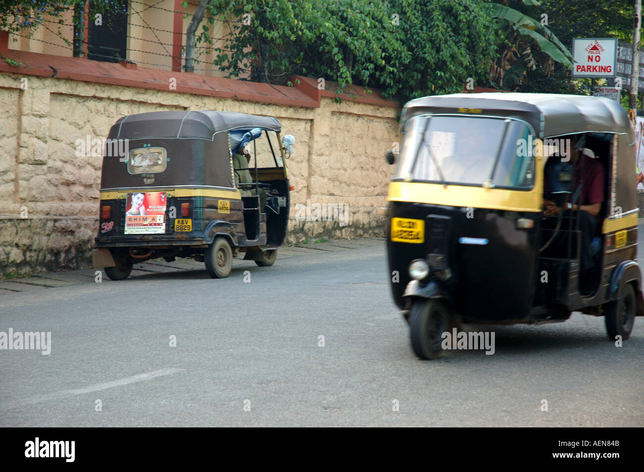 Two auto rickshaws in road in Trivandrum Thiruvananthapuram Kerala India travel Stock Photo