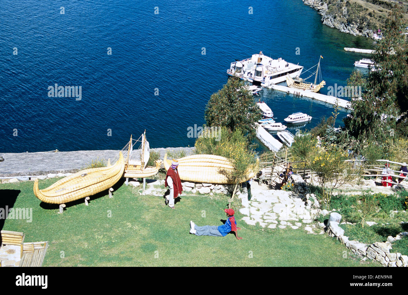 People beside replica reed boats, Inti Wata Cultural Complex, Sun
